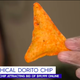 TV News screenshot of hand holding puffy Dorito